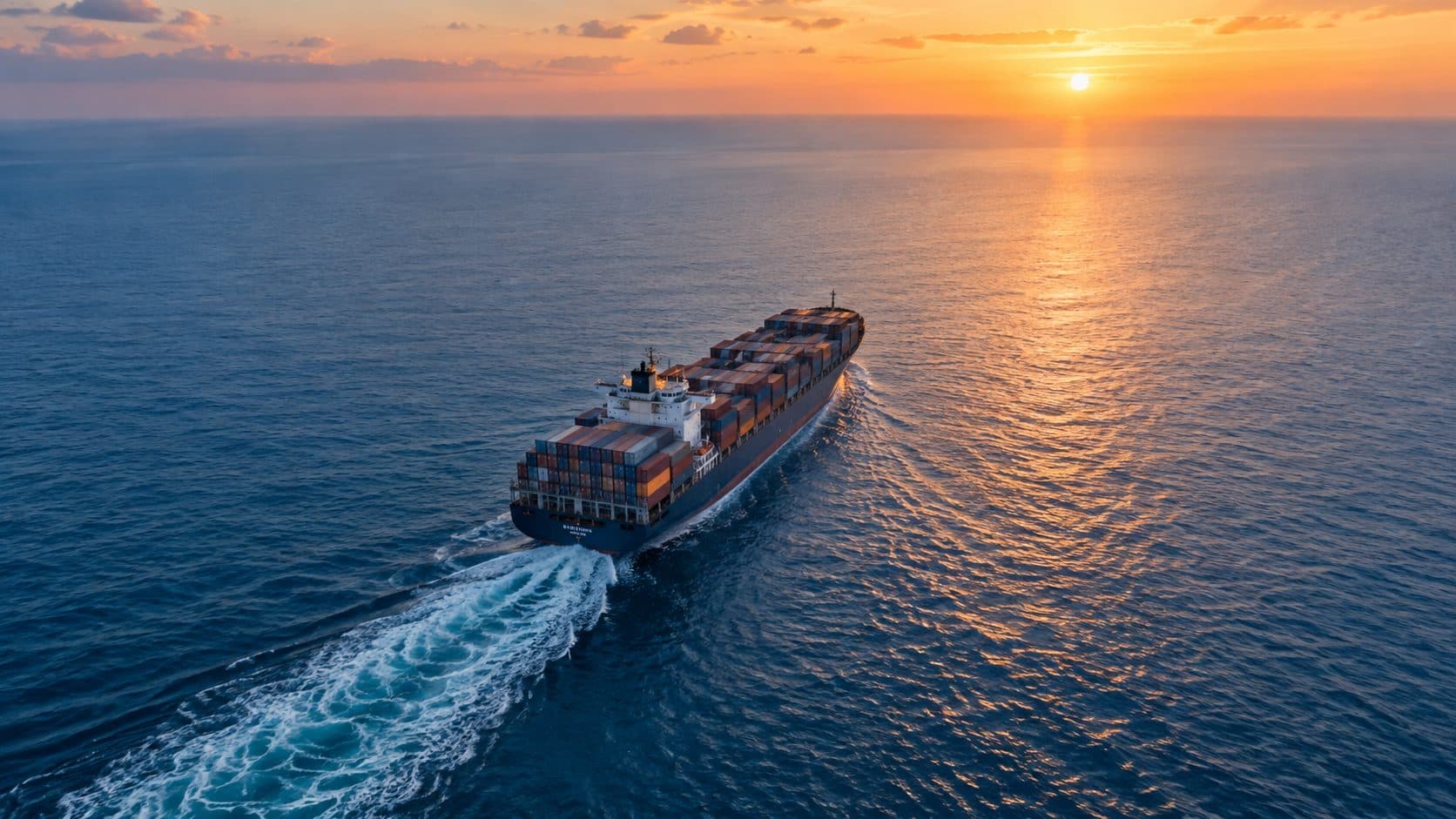 A vessel under way on open ocean at sunset